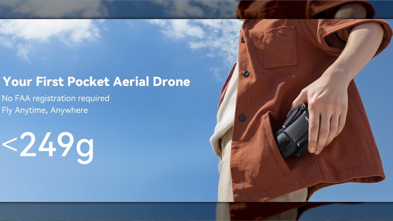 A person sliding the folded Ruko U11MINI 4K drone into a shirt pocket to show its small size.
