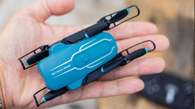 The Oviliee S17 drone being held easily in a person's palm.