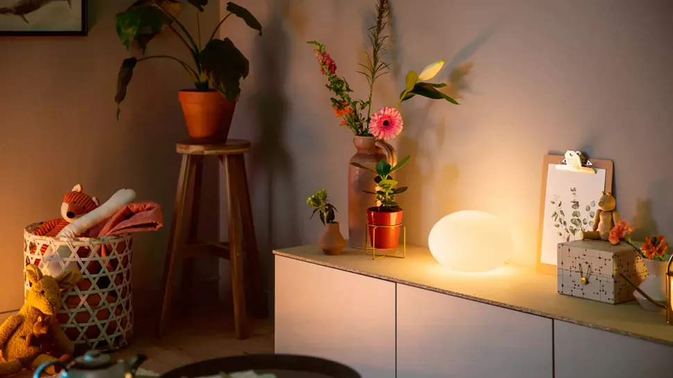 A close-up of a modern smart home hub on a tabletop, symbolizing the central control point of an automated home.