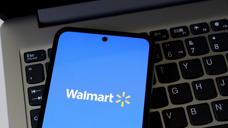 A smartphone screen displaying the Walmart logo.
