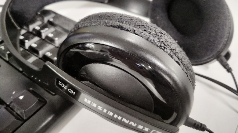 Close-up of weathered headphone ear cushions that are reaching the end of their lifecycle and need replacement.