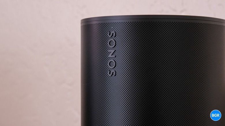A high-detail front view of the black Sonos Era 100 speaker.