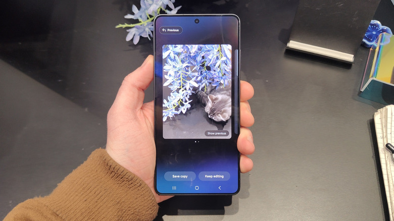 The Galaxy S26 Ultra screen showing the Generative Edit interface with a prompt adding a cat to a floral photo.