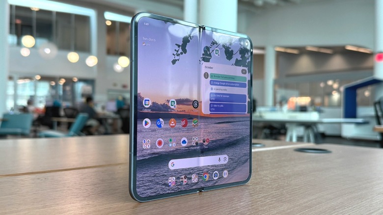 The Google Pixel 10 Pro Fold lying flat on a table.