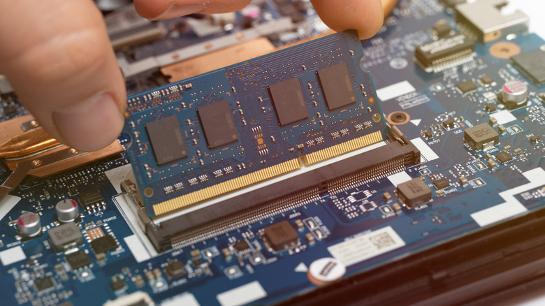 Close-up of a laptop internal motherboard showing RAM slots.