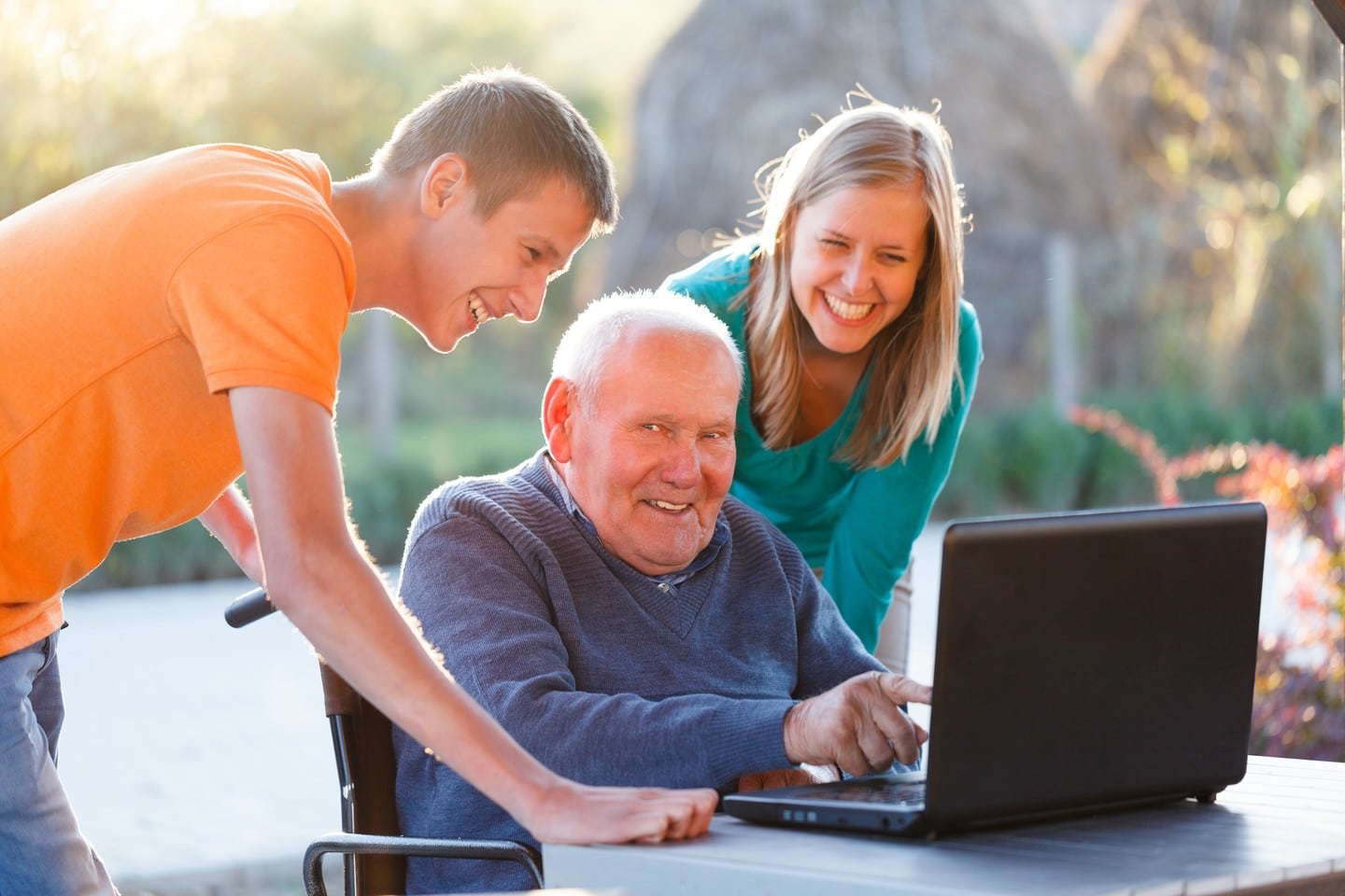 An assortment of senior-friendly tech gadgets including a simplified tablet and a wearable fall detection device.