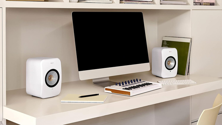 A pair of KEF LSX II active wireless speakers in a blue finish.