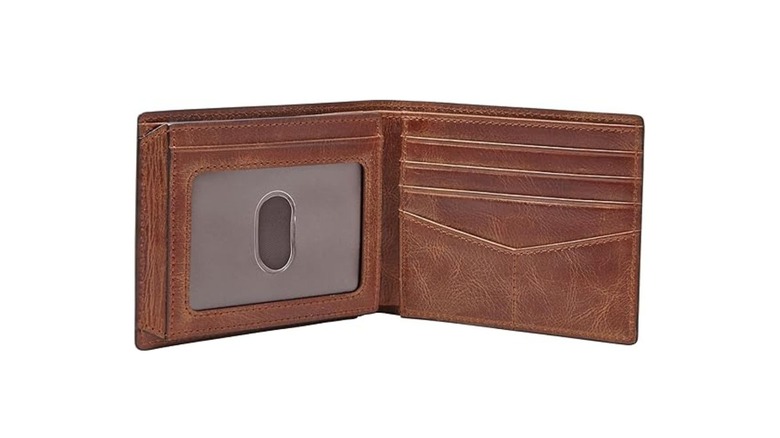 A traditional men's bifold leather wallet showing a transparent ID holder.