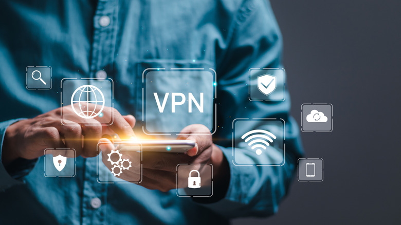 A person interacting with a security or VPN application on a mobile device.