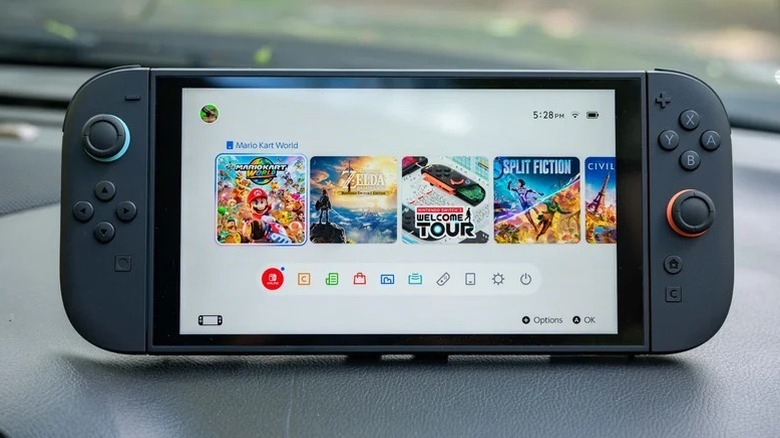 A Nintendo Switch 2 console placed on a car dashboard.