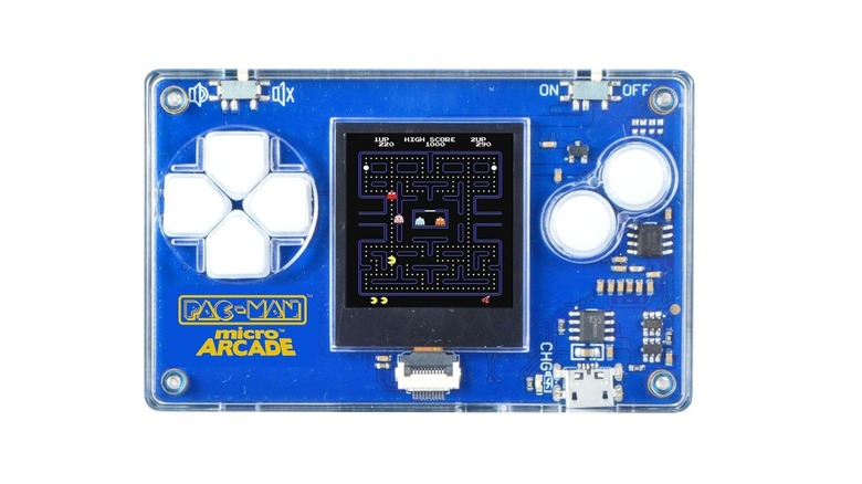 A transparent micro arcade keychain showing the internal circuit boards and a playable screen.