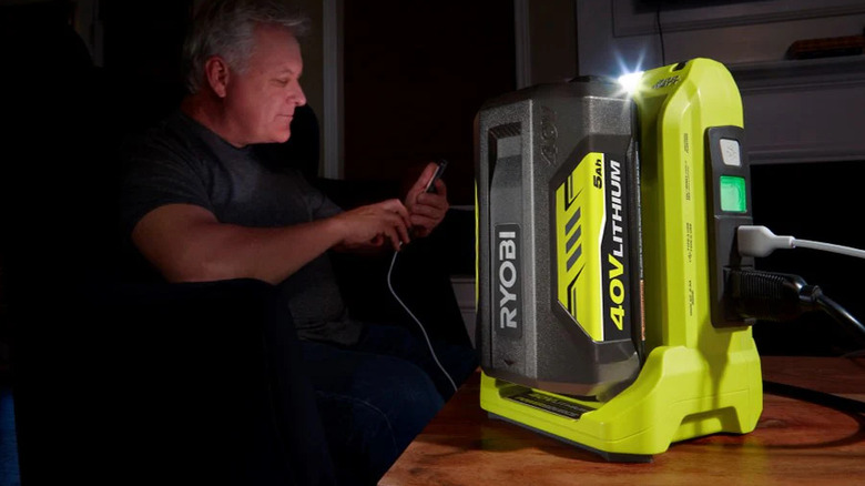 A Ryobi 40V Power Source providing electricity to home devices during an outage.